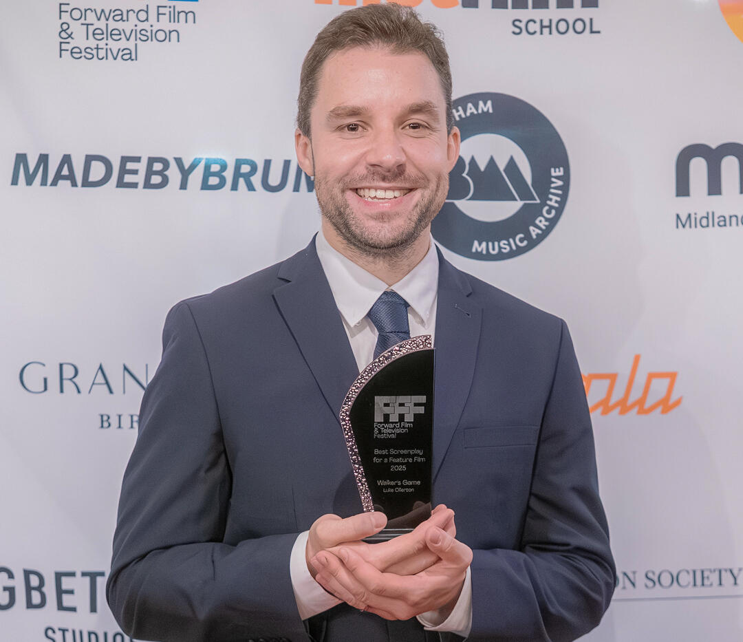 Luke Ollerton Luke Ollerton holding the Best Feature Screenplay award at the Forward Film & Television Festival.